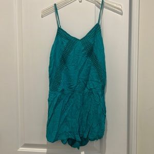 Turquoise romper with embroidered detailing